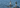 Two men paddling inflatable stand up paddle boards