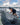 A larger wakesurfer leaning into a powerful bottom turn on the stable Phase 5 Cap'tin Wakesurf Board.