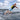 Wakesurfer executing a deep, powerful bottom turn at the base of the wave on the Phase 5 Trident.