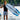 Sammy Goncalves standing on the boat swim platform with his pro model Phase 5 Viper wakesurf board in hand.