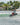 Wakeboarder laying down a powerful slash and throwing a massive spray on the wake with the 2026 Ronix District wakeboard setup.