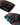 Close-up of the bottom nose and tail of the Ronix Krush 125cm wakeboard showing the molded fins, removable center fin, and asymmetrical channel design.