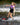 Young girl grom riding with one hand off the handle and cruising comfortably outside the wake on the 2026 Ronix Krush 125cm wakeboard setup.