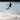 Young grom wakeboarder confidently executing a tailgrab in the air on the complete 2026 Ronix Kid's Vault wakeboard package.