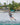 Female wakeboarder building line tension and loading up for a toeside wake jump on the 2026 Ronix Krush wakeboard setup.