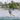 Female wakeboarder building line tension and loading up for a toeside wake jump on the 2026 Ronix Krush wakeboard setup.