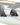 Close-up of the Ronix tool-less button fin box and carbon-fiber quad fin setup on the Atlantik board.