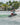 Rider performing a powerful heelside slash on the versatile 2026 Ronix District wakeboard.