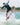 Rider catching air off the wake on a 2026 Ronix DNA Flyweight Pro wakesurf board.
