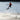 Young rider performing a wake-to-wake tail grab on the 2026 Ronix Kid's Vault 130cm.