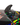 Close-up of the quad-fin configuration featuring the Ronix tool-less Button Fin system, cheese grater fin and nubs on the new 2027 Ronix M50 Dark Matter wakesurfer.