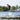 Youth rider catching air and performing a tail grab wake-to-wake jump on the 2026 Ronix Vision.