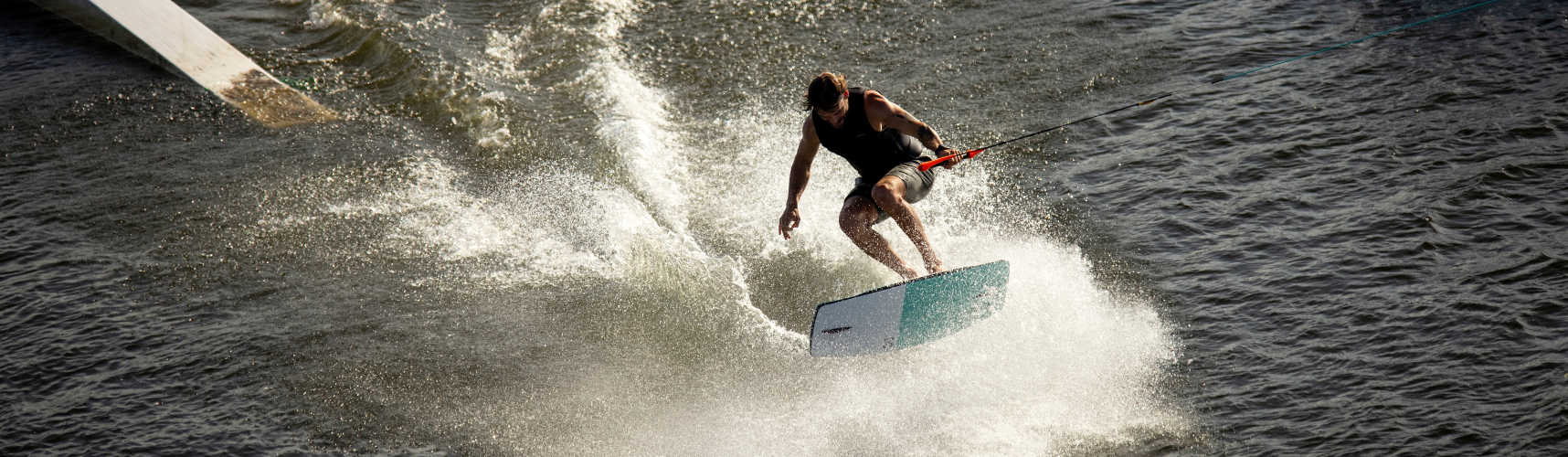 Man jumping while on a wakeskate