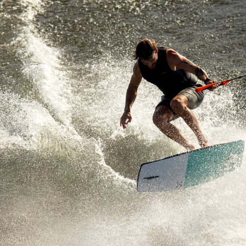 Man jumping while on a wakeskate