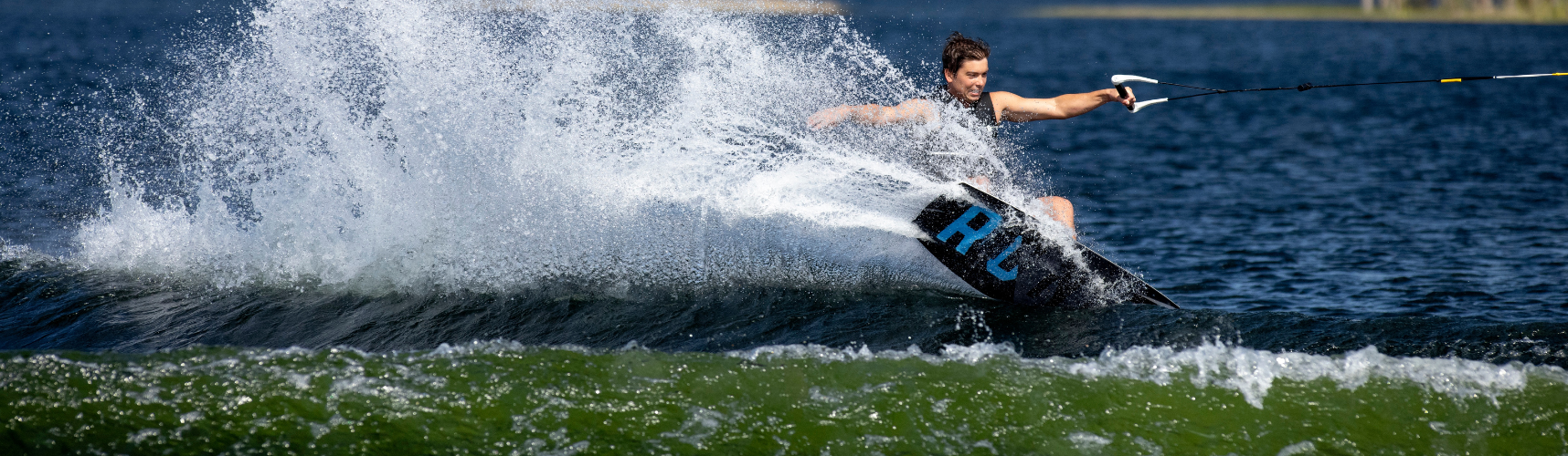 Man riding a Liquid Force Wakeboard