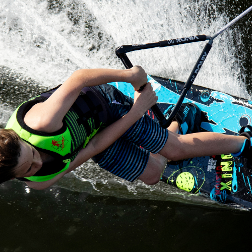 Kid riding a 2024 Ronix Vision Beginner Wakeboard