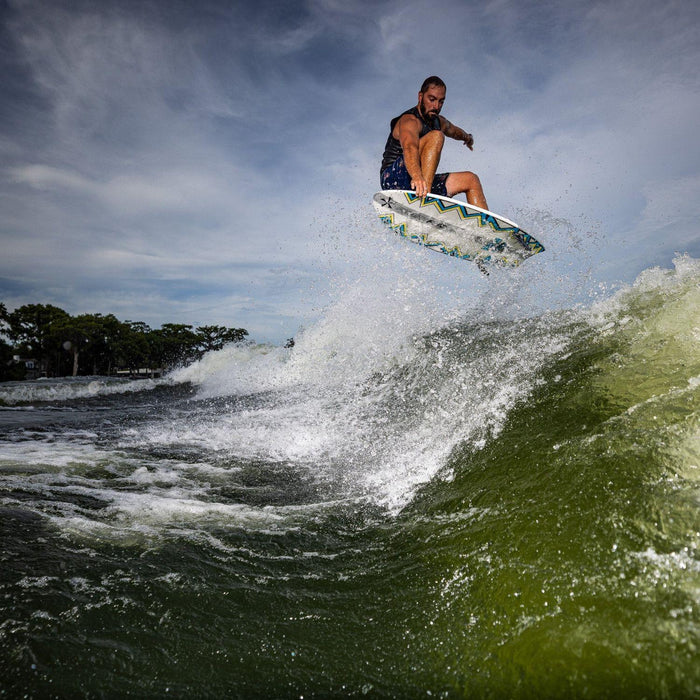 John Akerman catching massive air with a clean nose grab on the 2026 Phase 5 Ahi wakesurfer.