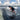 A larger wakesurfer leaning into a powerful bottom turn on the stable Phase 5 Cap'tin Wakesurf Board.