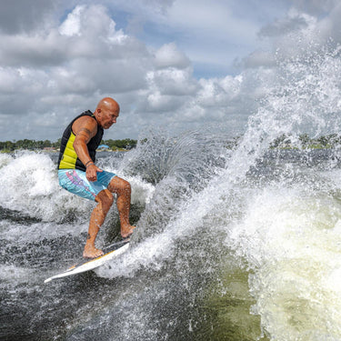A larger wakesurfer throwing a massive spray with a powerful slash on the Phase 5 Doctor.