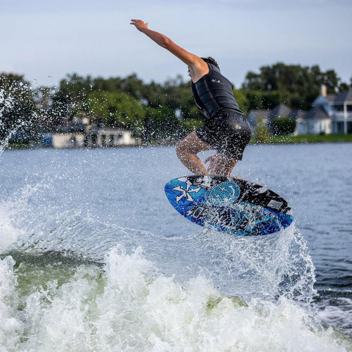 Young pro rider Jett Lambert spinning a clean ollie 360 on the lightweight Key Jett Shreds skim board.