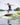 Pro rider Whitley Stewart spinning a technical 360 shuv-it mid-air on her Phase 5 Key pro model wakesurf board.