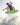 Pro wakesurfer launching a massive ollie 180 air off the lip of the wave on the 2026 Phase 5 Matrix skimmer.