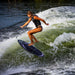 Pro wakesurfer Ashley Inloes performing a technical 360 shuv-it on her pro model Phase 5 Mindset.