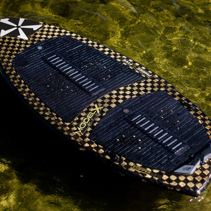 Angled in-water shot of the Phase 5 Model X LTD showing the premium EVA traction pads.