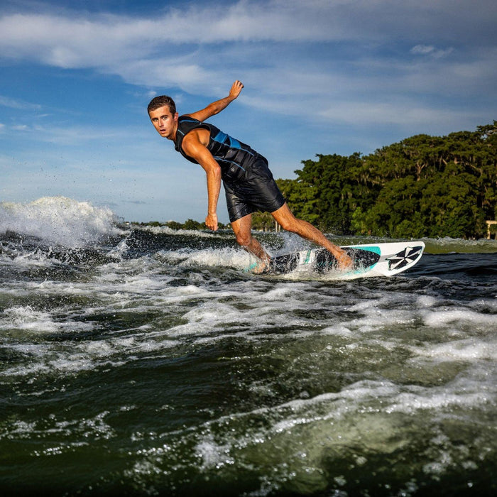 Parker Payne executing a powerful bottom turn on the Phase 5 Phantom, demonstrating elite rail and fin control.