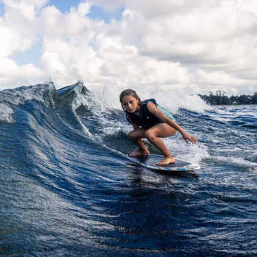 Young grom successfully surfing without the rope in the sweet spot on the Phase 5 Shrimp.