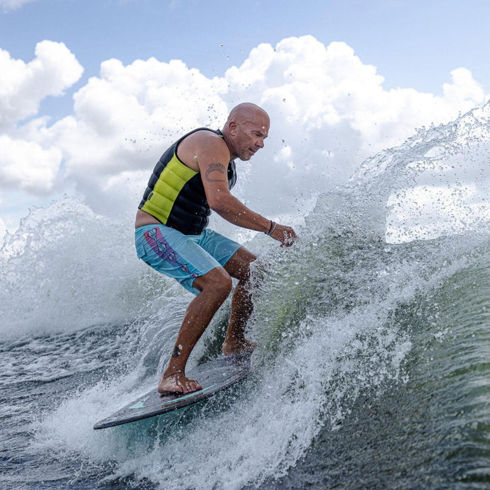 Rider throwing a massive spray while slashing the wake on the powerful Phase 5 Trident.