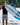 Sammy Goncalves standing on the boat swim platform with his pro model Phase 5 Viper wakesurf board in hand.