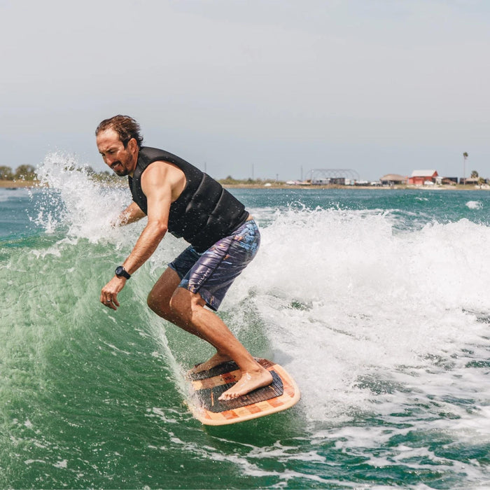 Erik Ruck carving the 2026 Ronix Blunt Nose Skimmer, showing the stability of the wide-nose shape.