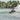 Wakeboarder laying down a powerful slash and throwing a massive spray on the wake with the 2026 Ronix District wakeboard setup.