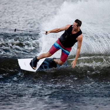 Wakeboarder riding the Ronix Vault board with Divide open-toe boots, showcasing a perfect entry-level progression setup.