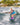 Young girl grom wakeboarder smiling and learning how to carve outside the wake on the complete 2026 Ronix August 120cm wakeboard package.