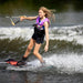 Young teen girl riding the Ronix Krush one-handed with a smile, demonstrating confidence and balance.