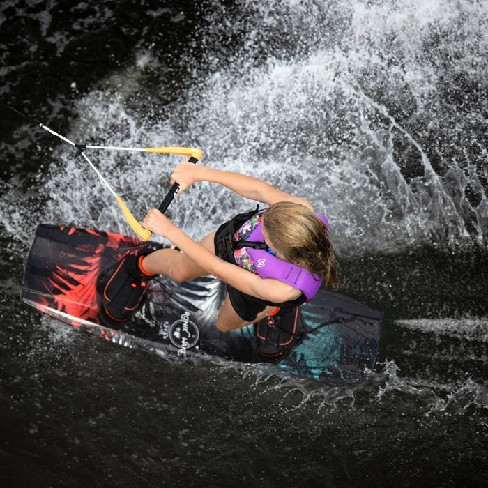 Overhead view of a young girl riding the 2026 Ronix Krush, showing the board's surface area and stability.