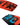 Close-up of the bottom of the Ronix Kid's Vault wakeboard highlighting the molded-in fins, large removable center fin, and asymmetrical channel design.