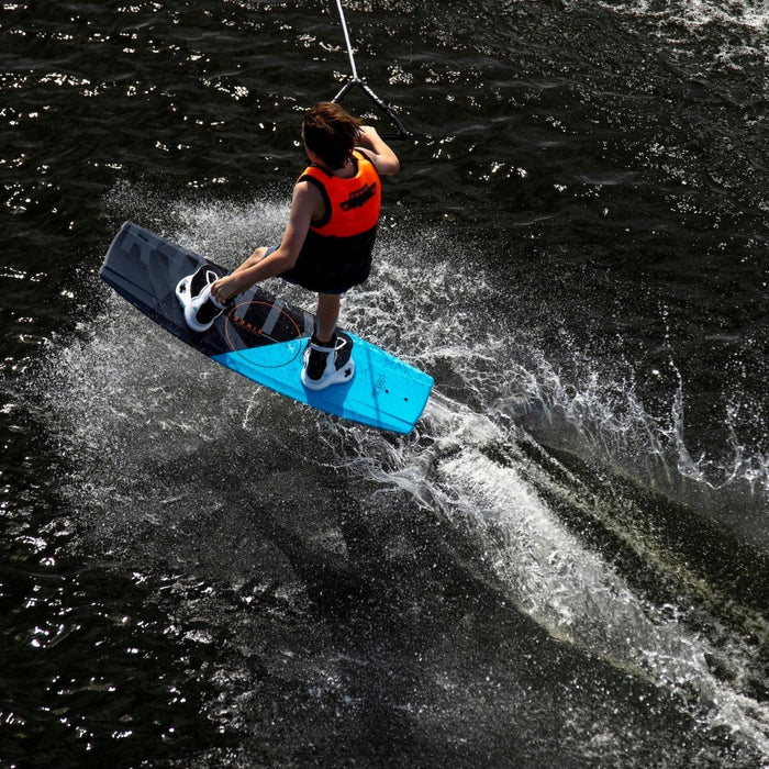 Young boy cruising one-handed on the 2026 Ronix Vault, demonstrating the board's easy edge control.