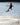 Young grom wakeboarder confidently executing a tailgrab in the air on the complete 2026 Ronix Kid's Vault wakeboard package.