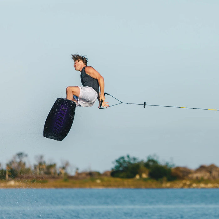 Tyler Higham mid-rotation during a technical 720 on the Ronix One Blackout, showing its low swing weight.
