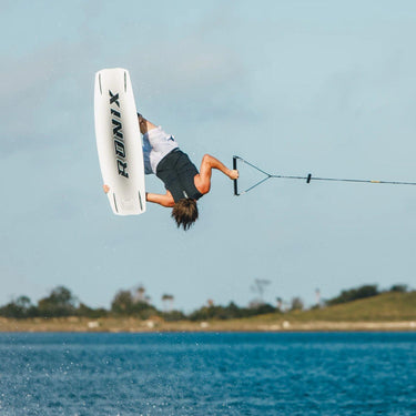 Pro rider Tyler Higham executing a massive tweaked-out invert using the Ronix One Legacy wakeboard and Ronix Anthem BOA wakeboard boot package.
