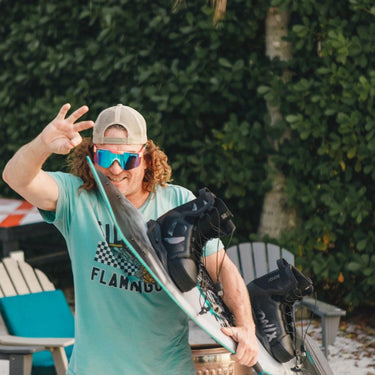 The legend Parks Bonifay walking to the boat with his signature pro model 2026 Ronix Parks board and boot setup.