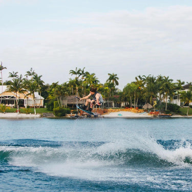 Pro rider Parks Bonifay launching a massive heelside wake-to-wake air on his complete 2026 Ronix Parks wakeboard setup.