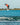Pro rider Giulia Castelli completing a technical wake-to-wake 720 spin on her 2026 Ronix Rise wakeboard setup.