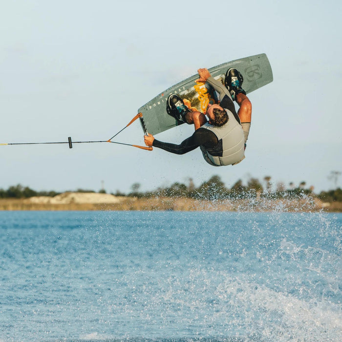 Pro rider Jake Pelot performing a massive indy grab backroll on his 2026 Ronix Supreme pro model wakeboard.