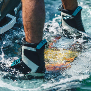 Pro rider Jake Pelot on the swim step with his 2026 Ronix Supreme board and Supreme BOA boots setup.