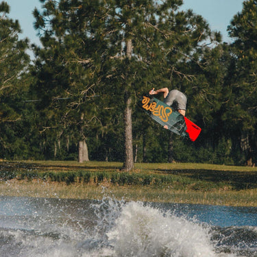 Pro rider Jake Pelot getting completely inverted using his pro model 2026 Ronix Supreme wakeboard setup.