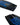 Close-up of the bottom tip and tail of the Ronix Vault wakeboard highlighting the molded-in fins, large removable center fin, and asymmetrical channel design.